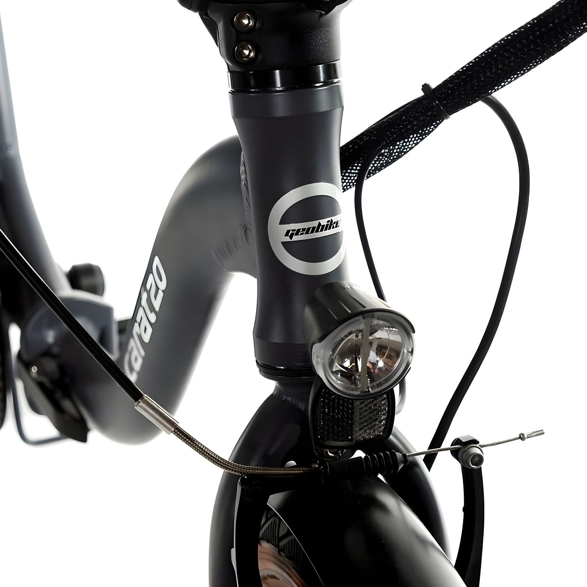 A close-up of the front light and handle of the Geobike Carat 2.0 E-Bike.